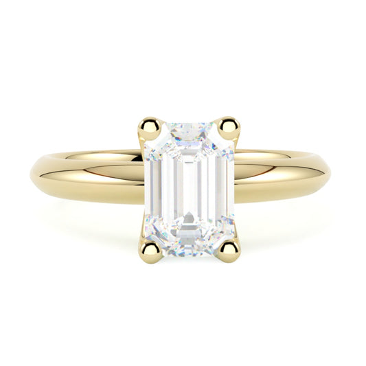 Złoty pierścionek z diamentem w szlifie szmaragdowym w żółtym złocie